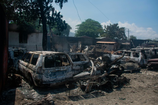 Charred wrecks of vehicles in Port-au-Prince, March 25, 2024 in Haiti CLARENS SIFFROY / AFP/ARCHIVES  