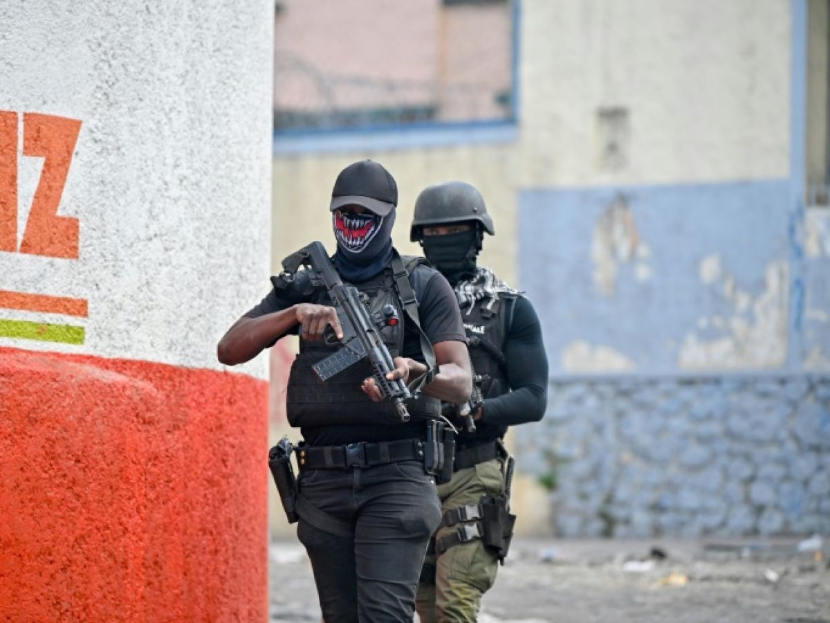 Police officers patrol during a demonstration calling for the resignation of Prime Minister Ariel Henry in Port-au-Prince, Haiti, February 7, 2024 RICHARD PIERRIN / AFP  
