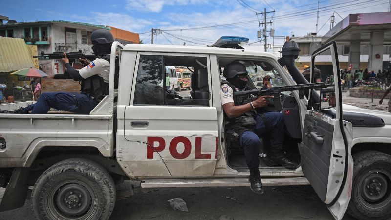 Police officers patrol a neighborhood amid gang-related violence in downtown Port-au-Prince on April 25, 2023. Richard Pierrin/AFP/Getty Images  
