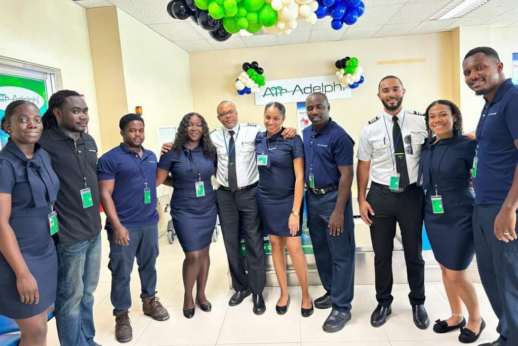  Air Adelphi staff at the Argyle international airport celebrating the launch of its new service. (Photo credit: API) 