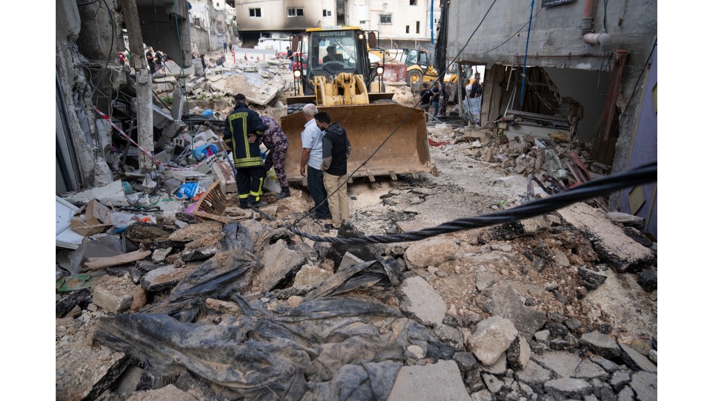  Palestinian municipality workers clear the rubble in the West Bank refugee camp of Nur Shams, Tulkarem, Sunday, April 21, 2024. (AP Photo/Nasser Nasser)

