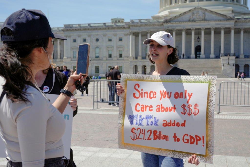  A TikTok content creator, speaks to reporters outside the US Capitol, Tuesday, April 23, 2024, in Washington, as Senators prepare to consider legislation that would force TikTok's China-based parent company to sell the social media platform under the threat of a ban, a contentious move by U.S. lawmakers. (AP Photo/Mariam Zuhaib)