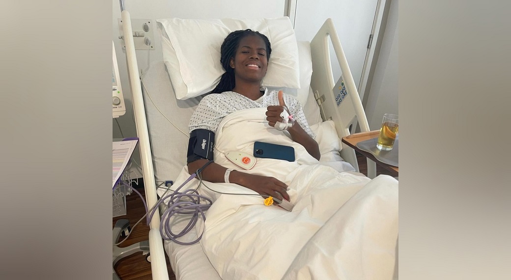 Khadija Shaw in hospital giving the thumbs-up after her surgery. 
