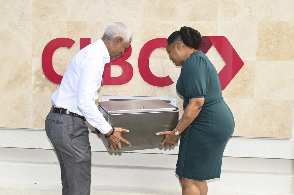 Donna Wellington and Brian Clarke as they insert the stainless-steel time capsule into its resting place for the next 50 years.