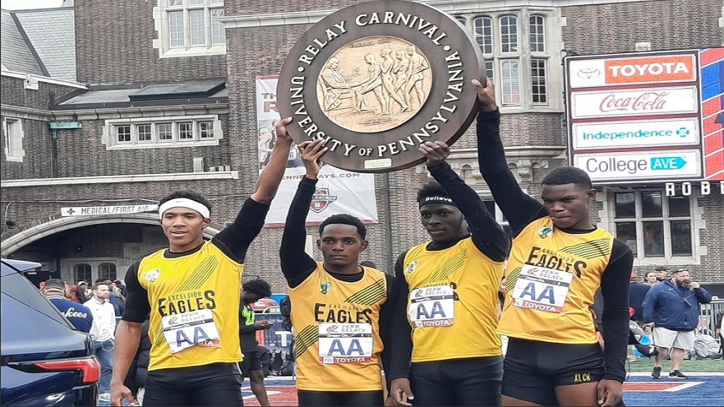 Excelsior High's 4x100m team holds up the Championship 'Wheel' after winning the Championship of America race at the 128th Penn Relays Carnival at Franklin Field in Philadelphia, Pennsylvania on Saturay, April 27, 2024. (PHOTO: Melton Williams).
