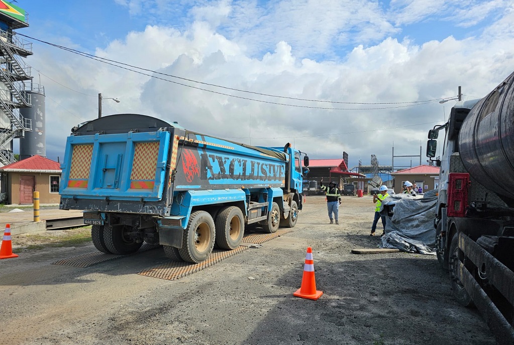 Road works being conducted on the East Bank of Demarara Public Road from Good Success to Timehri, Guyana. (Photo credit: Ministry of Public Works)