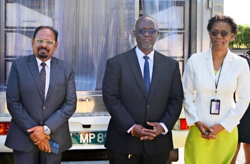 L-R: India’s High Commissioner to Barbados, Dr Shankar Balachandran; Permanent Secretary in the Ministry of Health and Wellness, Wayne Marshall; and Acting Director of the Barbados Drug Service, Delores Mascoll, pose with the refrigerated truck which was donated to the Barbados Drug Service by the Government of India. (Photo credit: GIS)