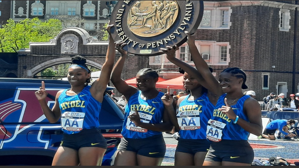 Hydel High's 4x100m team holds up the Championship 'Wheel' after winning the Championship of America race at the 128th Penn Relays Carnival at Franklin Field in Philadelphia, Pennsylvania on Friday, April 26, 2024. (PHOTO: Melton Williams).