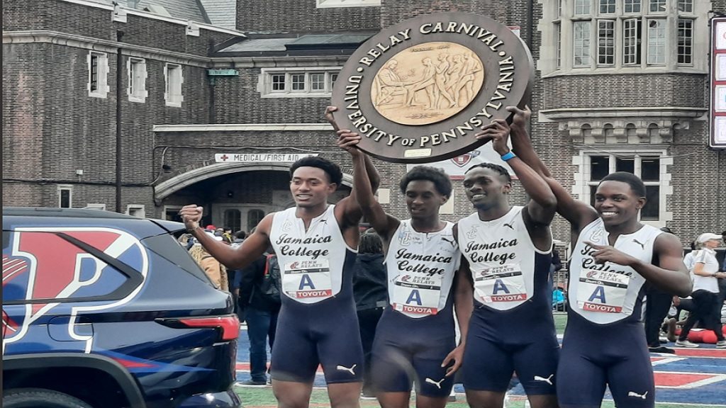 Jamaica College's 4x800m team holds up the Championship 'wheel' after winning the Championship of America race at the 128th Penn Relays Carnival at Franklin Field in Philadelphia, Pennsylvania on Saturday, April 27, 2024. (PHOTO: Melton Williams).
