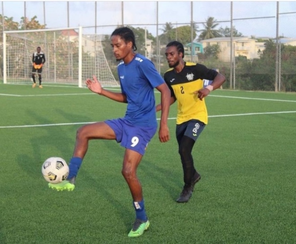 Empire's Kemar John (left), scored twice versus the Barbados Soccer Academy to help his team to a 4-1 victory in the Barbados Football Association Premier League.