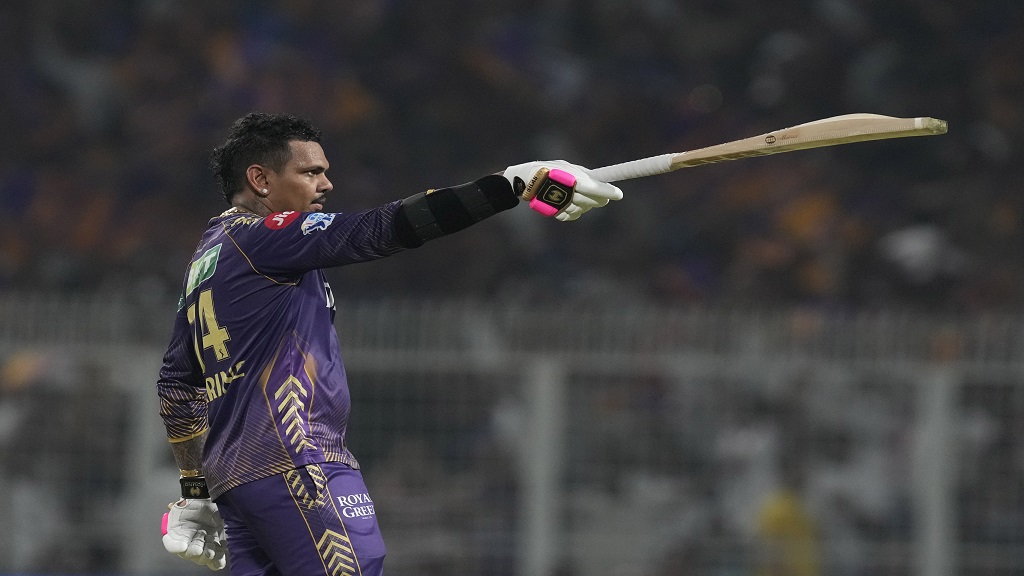 Kolkata Knight Riders' Sunil Narine commemorates scoring a century throughout the Indian Premier League cricket match versus Rajasthan Royals in Kolkata, India, Tuesday, April 16, 2024. (AP Photo/Bikas Das).