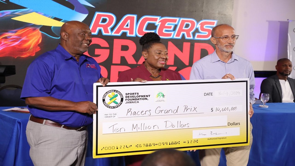  Sports Minister Olivia Grange (centre) is flanked by Glen Mills (left), founder and meet director of the Racers Grand Prix, and Allan Beckford, general manager of the Sports Development Foundation, as they showcase a $10 million cheque  provided by the minister during the launch of the sixth edition of the Racers Grand Prix at the Jamaica Pegasus hotel on Tuesday, April 16, 2024. (PHOTO: Marlon Reid).






