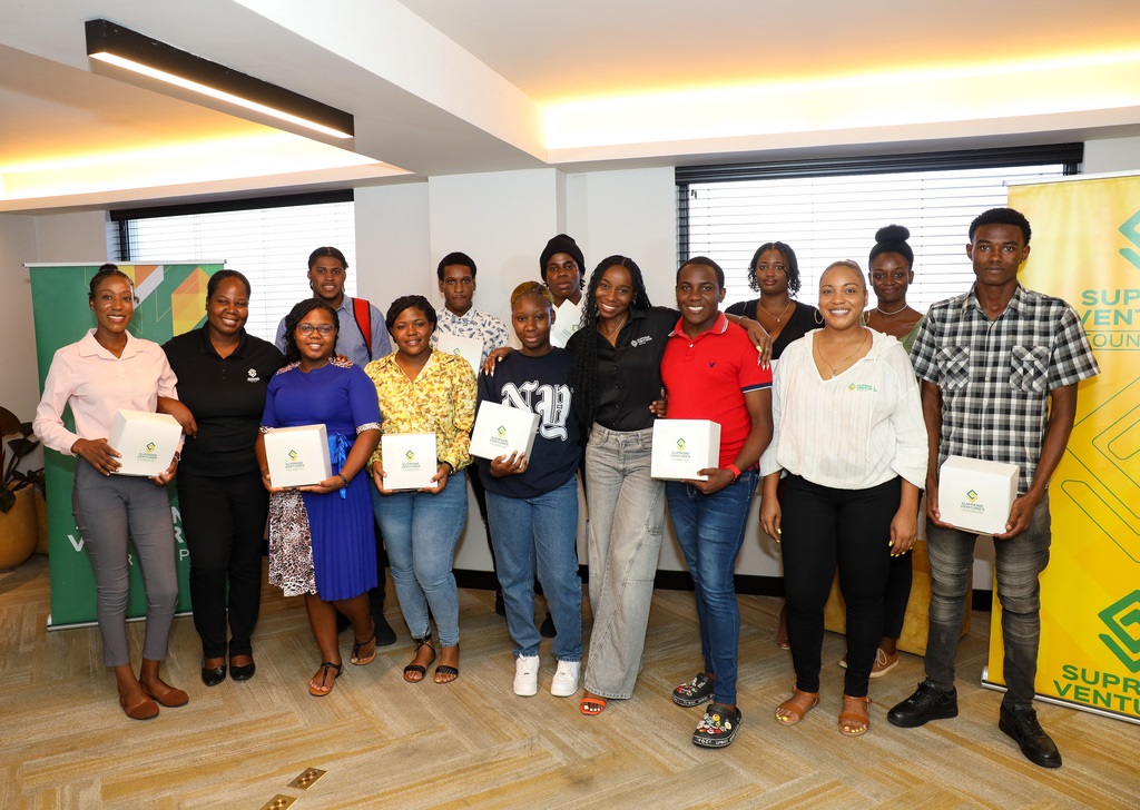 The Supreme Ventures Foundation presents gifts to some CPFSA participants as part of the Dream Supreme Flight experience. Pictured are members of the Supreme Ventures Foundation team and some CPFSA youths who boarded the exclusive flight.
