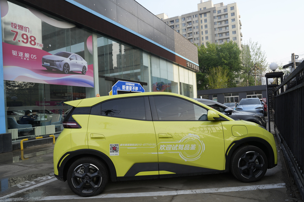 A Seagull electric vehicle from Chinese automaker BYD for test driving is parked outside a showroom in Beijing, Wednesday, April 10, 2024. The tiny, low-priced electric vehicle called the Seagull has American automakers and politicians trembling. The car, launched last year by Chinese automaker BYD, sells for around $12,000 in China. But it drives well and is put together with craftsmanship that rivals U.S.-made electric vehicles that cost three times as much. (AP Photo/Ng Han Guan)