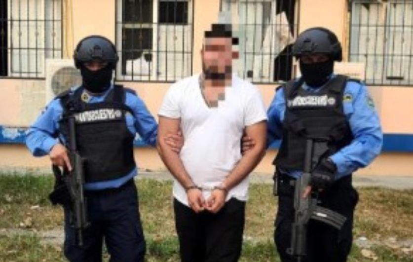 Centre: Man Being Arrested 
(Image: National Police of Honduras)