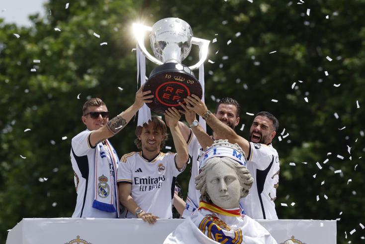 Real players celebrate their title of champion of Spain, in the streets of Madrid, May 12, 2024 AFP OSCAR DEL POZO  