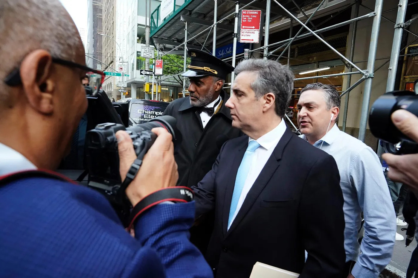 Lawyer Michael Cohen (c) leaves his home to go to the Manhattan criminal court where the trial of former US President Donald Trump is taking place, on May 14, 2024 in New York AFP TIMOTHY A. CLARY  