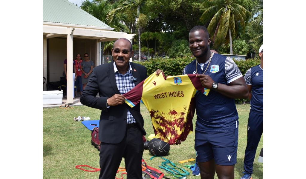  West Indies head coach Darren Sammy presents a West Indies shirt to Prime Minister of Antigua & Barbuda, Hon. Gaston Browne. (Photo credit - CWI Media)