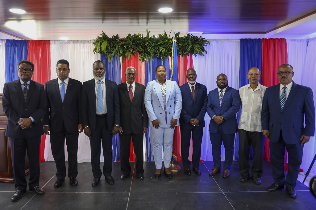  Transitional Council members, from left to right; Fritz Alphonse Jean, Laurent Saint-Cyr, Frinel Joseph, Edgard Leblanc Fils, Regine Abraham, Emmanuel Vertilaire, Smith Augustin, Leslie Voltaire and Louis Gerald Gilles, pose for a group photo after a ceremony to name its president and a prime minister in Port-au-Prince, Haiti, Tuesday, April 30, 2024. Fils was chosen as the president of the panel. (AP Photo/Odelyn Joseph)