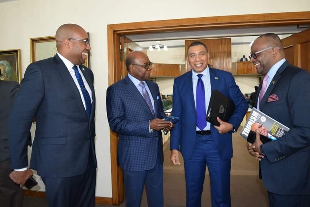 Prime Minister Andrew Holness in a lively discussion with Tourism Minister Edmund Bartlett (2nd left), Senior Tourism Advisor Delano Seiveright (left), and Director of Tourism Donovan White (right).



