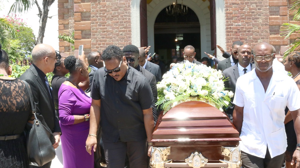Pall-bearers walk with the casket bearing the body of the late track and field analyst Hubert Lawrence after the Mass of Resurrection in celebration of his life at the Cathedral pf St Jago de la Vega in Spanish Town, St Catherine on Saturday.