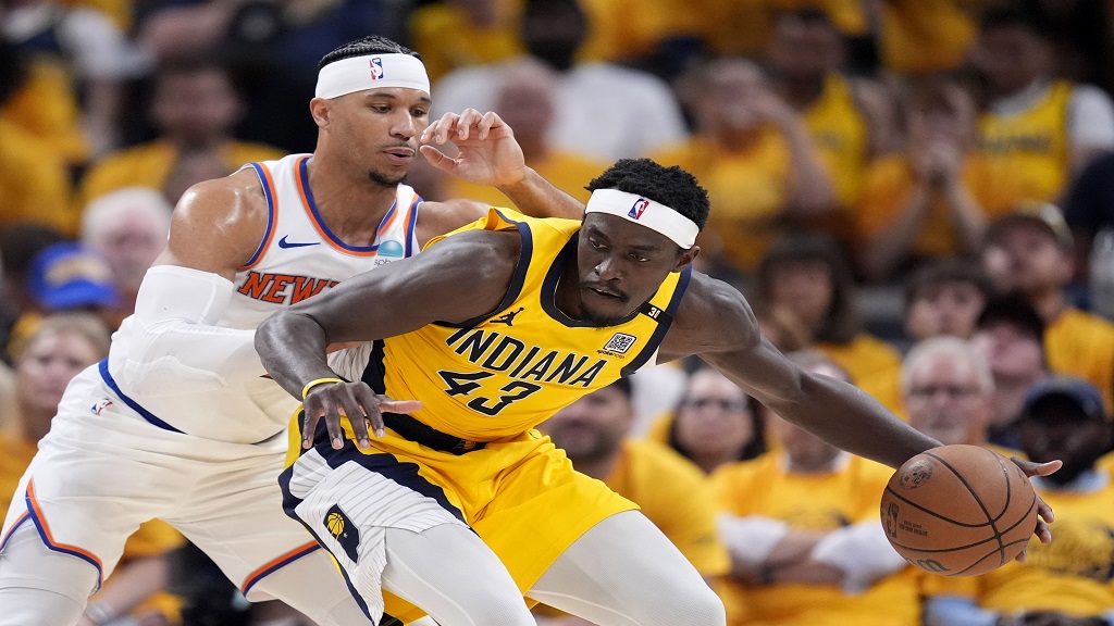 Indiana Pacers forward Pascal Siakam (43) drives around New York Knicks guard Josh Hart, left, during the first half of Game 6 in an NBA basketball second-round playoff series, Friday, May 17, 2024, in Indianapolis. (AP Photo/Michael Conroy).