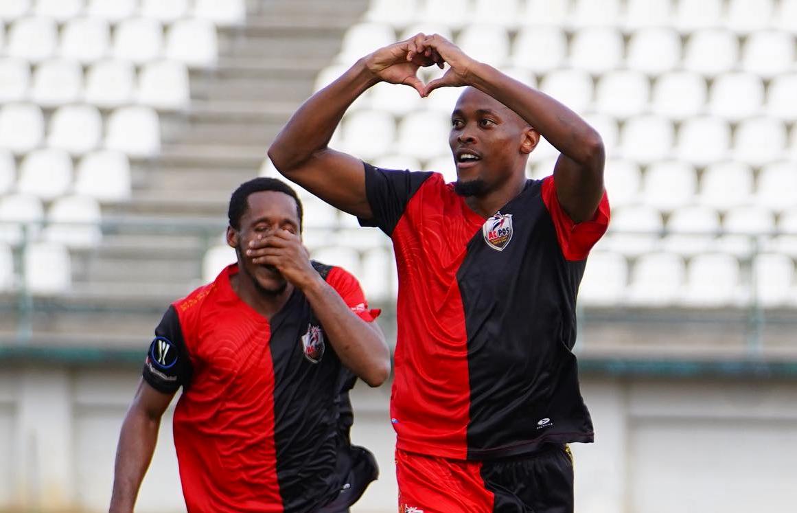  Jamal Charles (right) celebrates a goal against Club Sando in the TTPFL. (Photo credit - TTPFL Media)