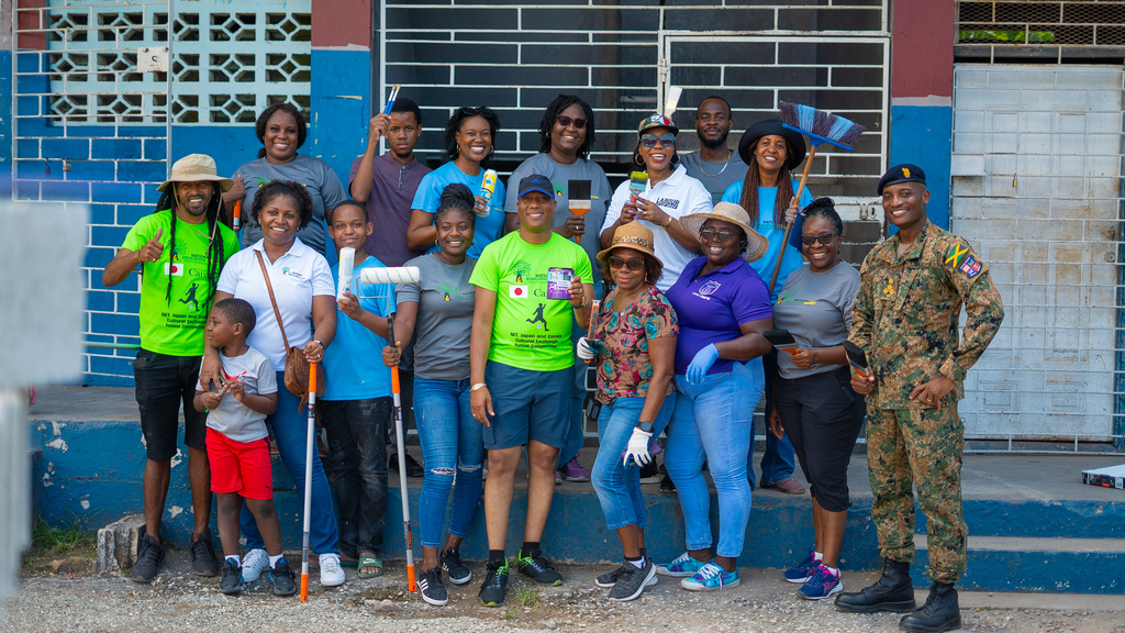 Representatives from the Ministry of Education and Youth, the National Education Trust (NET), the Jamaica Defence Force's Support Brigade and Swallowfield Primary and Infant School pose after a successful Labour Day project at the school. 