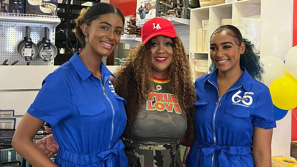 Dancehall artiste Tifa (centre) sharing a moment with Court's girls Kaela Jones (left) and Kayla Rose during an outside broadcast on May 13 at the Courts Ocho Rios store.