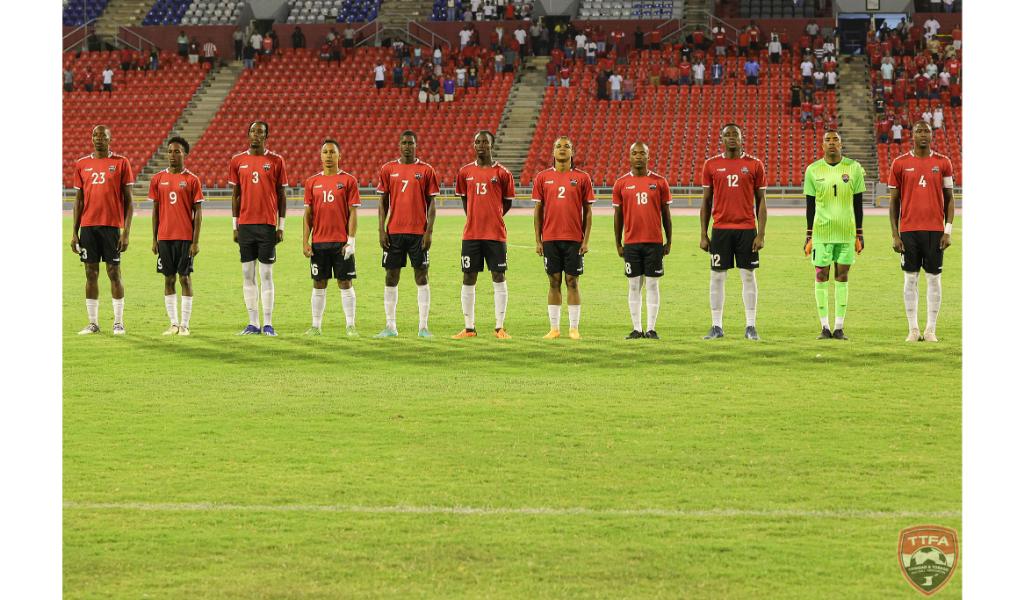 The Trinidad and Tobago team line up ahead of their international friendly against Guyana on Monday at the Hasely Crawford Stadium. (Photo credit - TTFA Media)