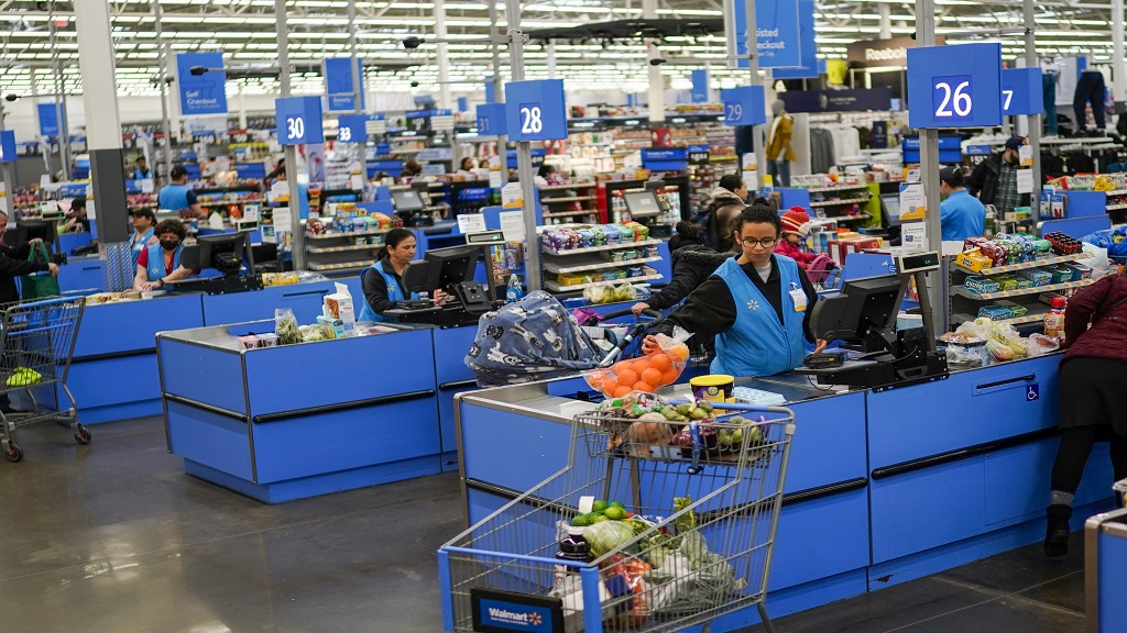 Cashiers process purchases at a Walmart Supercenter in North Bergen, N.J., on Feb. 9, 2023. (AP Photo/Eduardo Munoz Alvarez, File)