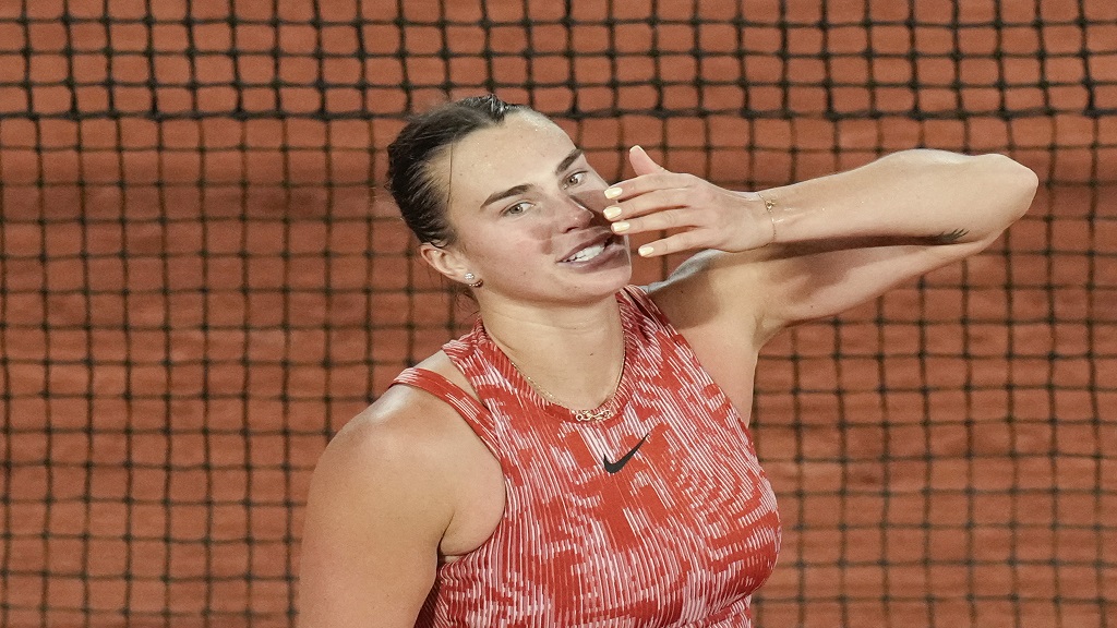 Aryna Sabalenka of Belarus blows a kiss to cheering tennis fans after winning her third round match of the French Open tennis tournament against Spain's Paula Badosa at the Roland Garros stadium in Paris, Saturday, June 1, 2024. (AP Photo/Christophe Ena).