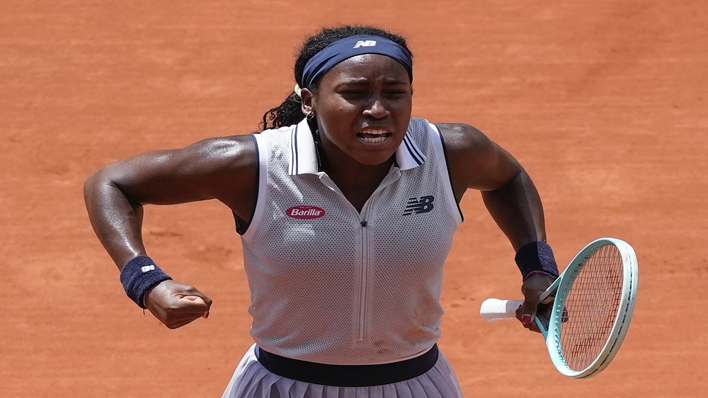 Coco Gauff of the U.S. celebrates winning her quarterfinal match of the French Open tennis tournament against Tunisia's Ons Jabeur at the Roland Garros stadium in Paris, Tuesday, June 4, 2024. (AP Photo/Thibault Camus).