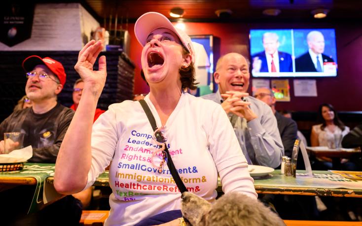 Customers react during the televised debate between Joe Biden and Donald Trump, at a pub in San Francisco, California, on June 27, 2024 AFP JOSH EDELSON  