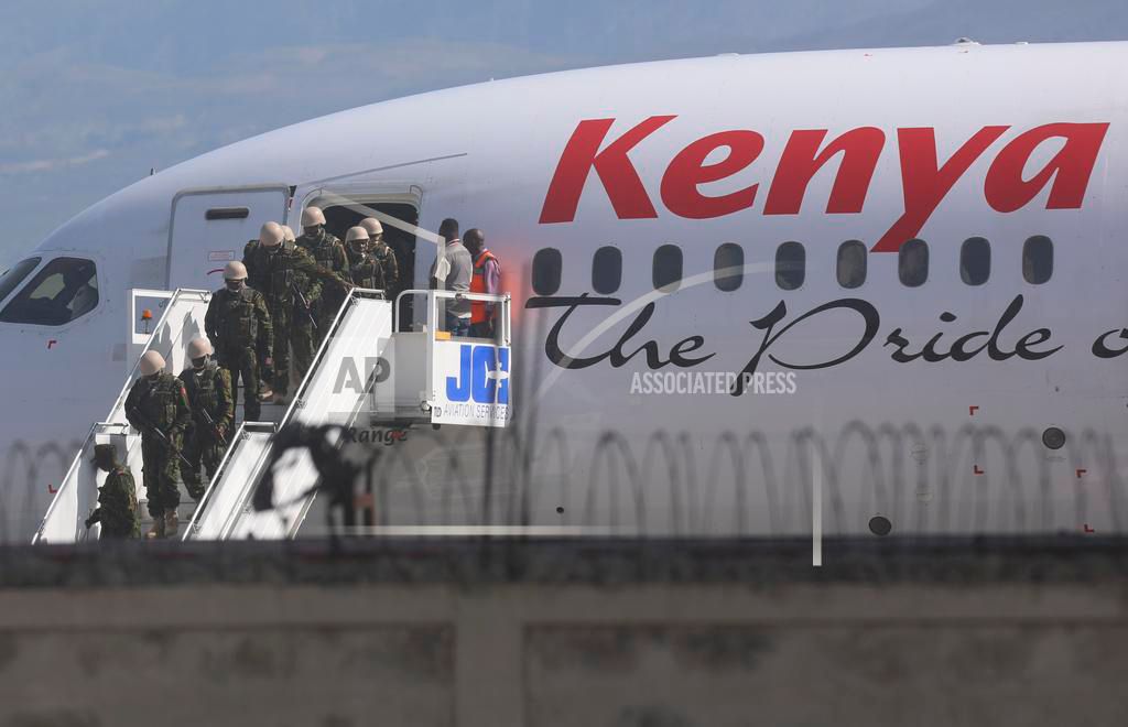 Kenyan police officers landed in Port-au-Prince on Tuesday.  Photo: AP Photo/Marckinson Pierre.