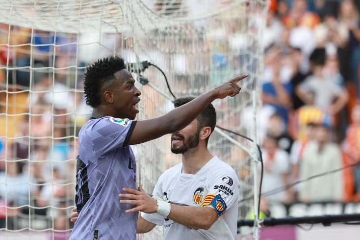 Real Madrid's Brazilian striker Vinicius Jr pointing the finger at spectators uttering racist insults towards IU during a championship match against Valencia on May 21, 2023 JOSE JORDAN / AFP/ARCHIVES  