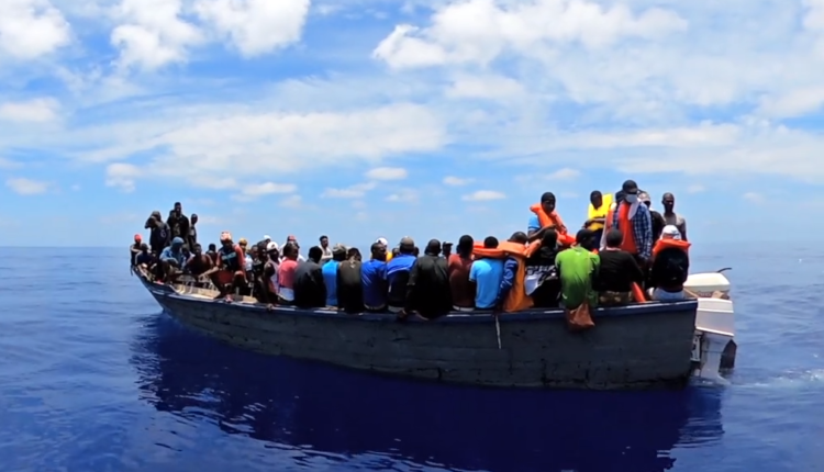 Migrants on a small boat. Photo credit: @USCGSoutheast