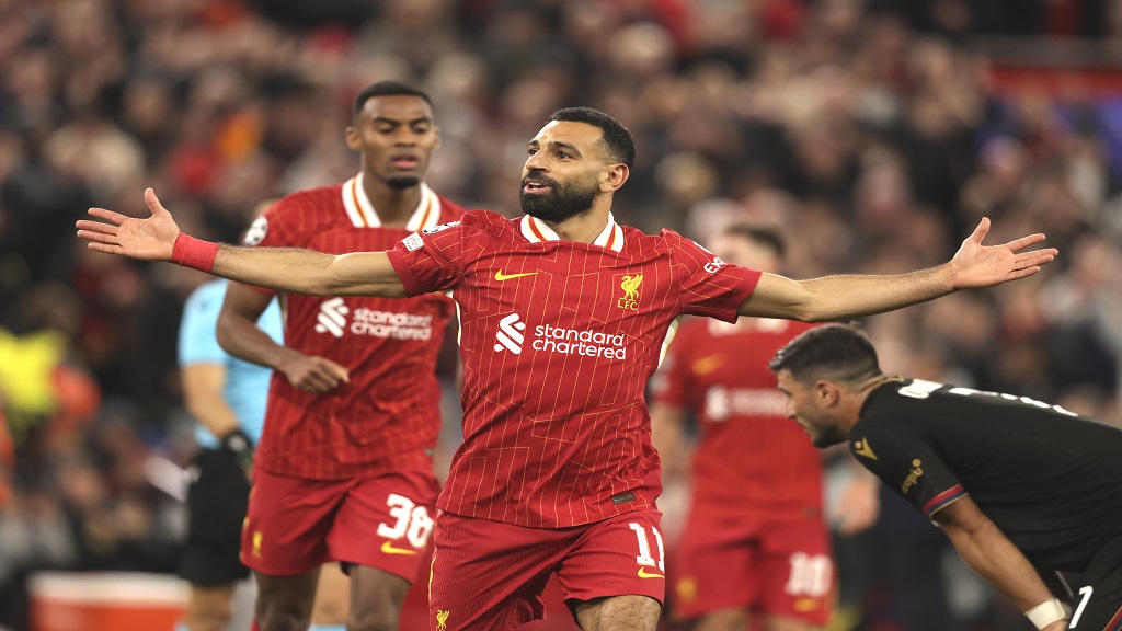 Liverpool's Mohamed Salah celebrates after scoring his side's second goal during the Champions League football match against Bologna at the Anfield stadium in Liverpool, England, Wednesday, Oct. 2, 2024. (AP Photo/Ian Hodgson).  