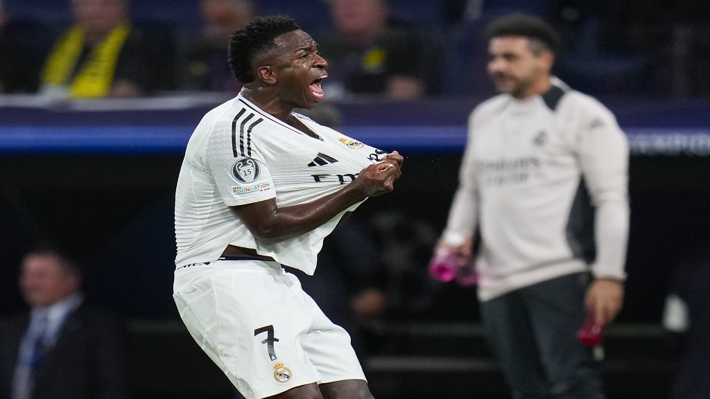 Real Madrid's Vinicius Junior celebrates after scoring his side's second goal during the Champions League opening phase football match against Borussia Dortmund at the Santiago Bernabeu stadium in Madrid, Tuesday, Oct. 22, 2024. (AP Photo/Manu Fernandez).