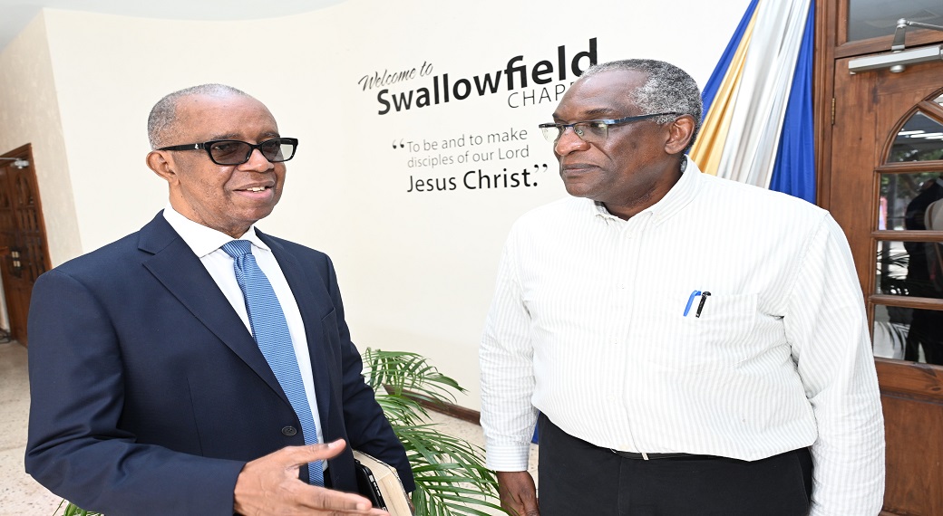 Dr Lucien Jones (left), Vice Chairman of the National Road Safety Council (NRSC), makes a point to Pastor David Henry of Swallowfield Chapel ahead of the annual NRSC church service to commemorate the World Day of Remembrance for Road Traffic Victims.