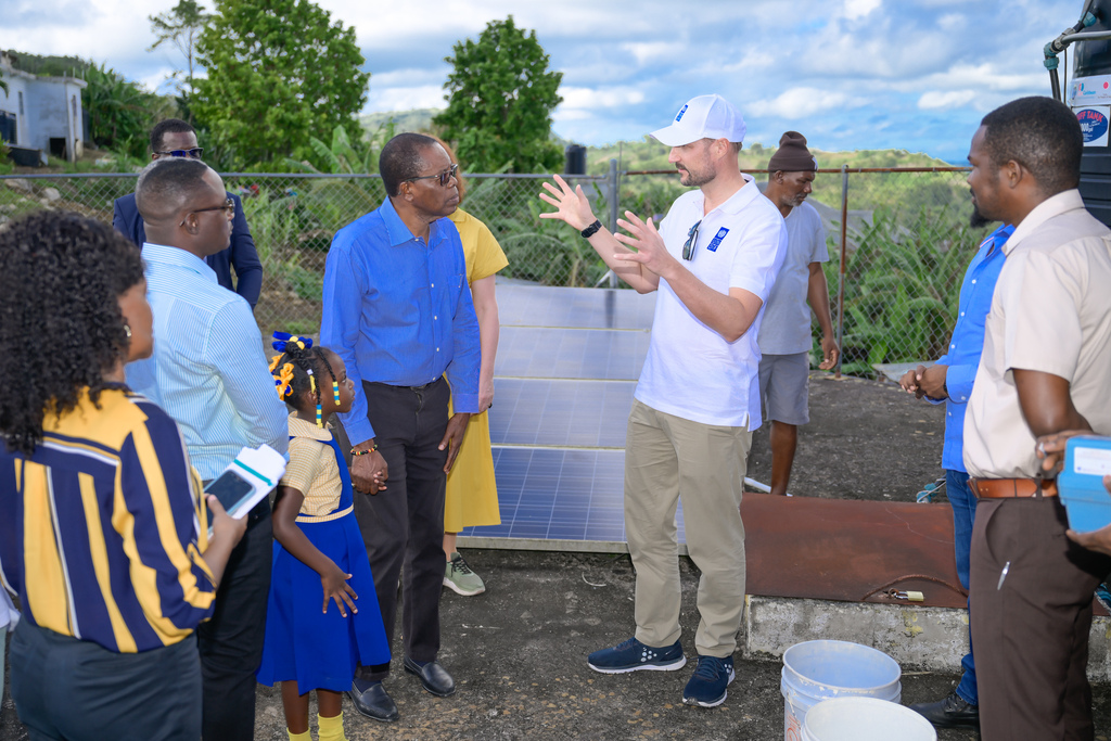 Crown Prince Haakon of Norway (second right), who is a United Nations Development Programme (UNDP) Goodwill Ambassador, in discussion with Mayor of May Pen, Councillor Joel Williams (centre), during Monday’s (November 18) tour of the Pleasant Valley water harvesting system in Clarendon.