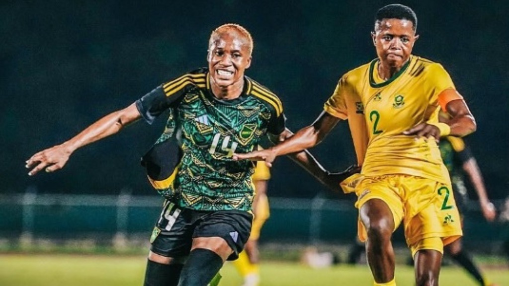 Jamaica's Deneisha Blackwood (left) battles for possession against South Africa's Lebohang Ramalepe during an international friendly at the Catherine Hall Sports Complex, Montego Bay, on Friday, November 29, 2024. (Photo: JFF media)