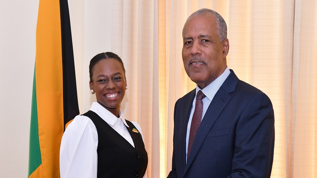 The 2025 Rhodes Scholar Aundrene Cameron shares a photo with Governor-General, Sir Patrick Allen. 