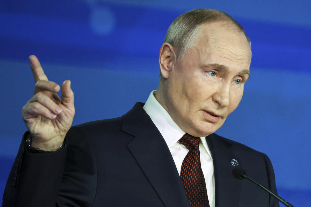 Russian President Vladimir Putin points during a meeting with foreign policy experts at the Valdai Discussion Club in the Black Sea resort of Sochi, Russia, Thursday, Nov. 7, 2024. (Maxim Shipenkov/Pool Photo via AP)  