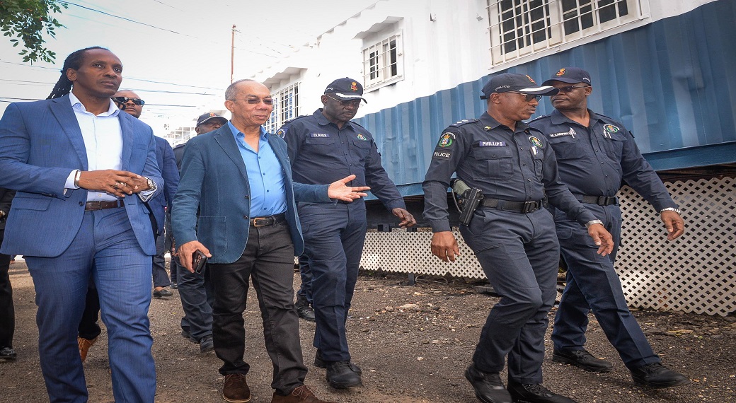 National Security Minister, Dr Horace Chang (second left), tours sections of the Gregory Park community in Portmore, St Catherine, during a recent visit to the Gregory Park Mobile Command. He is accompanied by (from left) Member of Parliament for St Catherine East Central,Alando Terrelonge and Head of Strategic Operations, Deputy Commissioner of Police, Warren Clarke; Acting Assistant Commissioner of Police, Christopher Phillips.