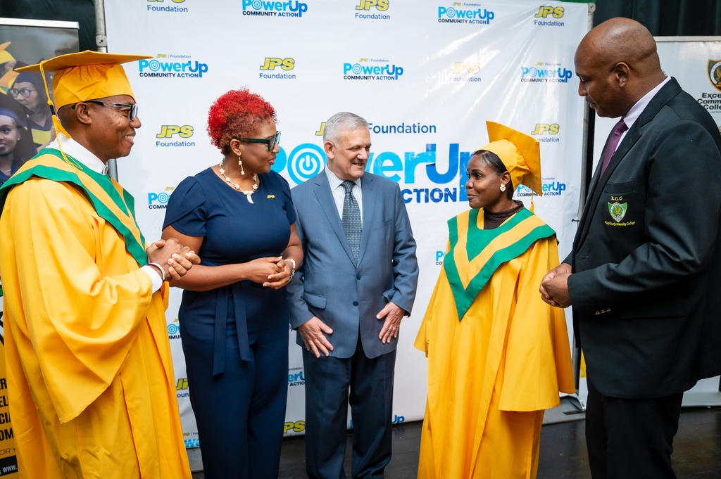 Kimberly Jones (second right), a solar installation-certified graduate of the Power Up  Community Action (CA) programme shared insights into her 24-week-long experience with JPS Foundation Chairman Damian Obligio (centre) and Head of the Foundation Sophia Lewis while electrical installation graduate Dennis Orane (left) and Duane Muirhead, senior director at the Centre for Professional Development and Continuing Education at Excelsior Community College listened attentively.