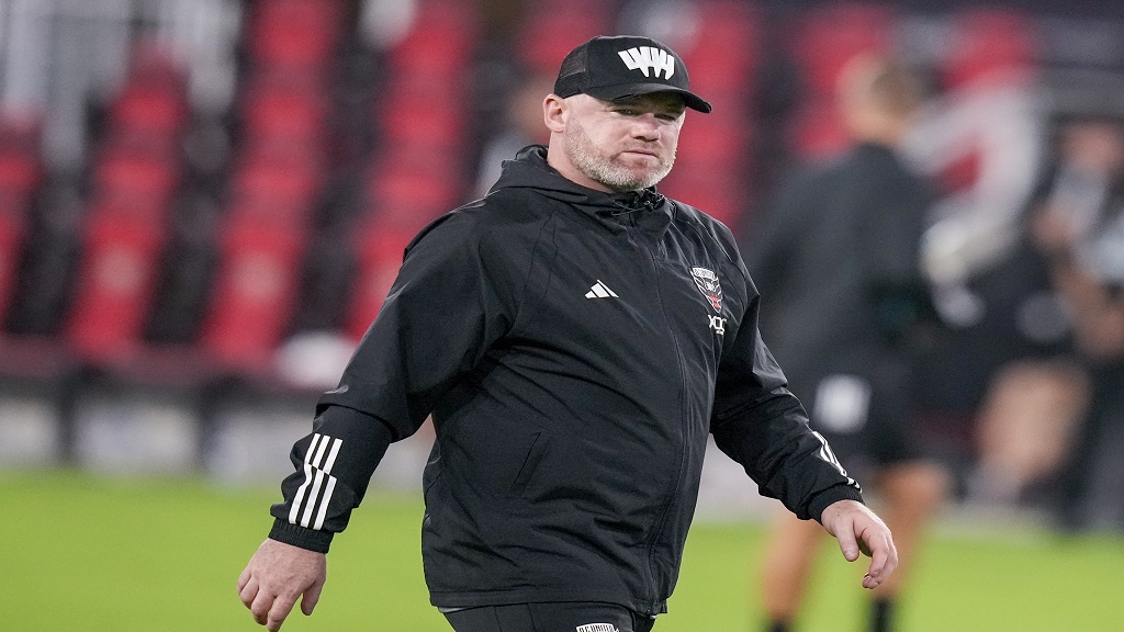 Then D.C. United head coach Wayne Rooney walks off the field after the team's MLS soccer match against Inter Miami, July 8, 2023, in Washington. (AP Photo/Alex Brandon, File).