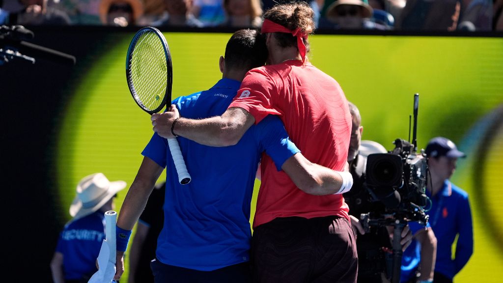 Alexander Zverev, right, of Germany embraces Novak Djokovic of Serbia after Djokovic retired in their semifinal match at the Australian Open tennis championship in Melbourne, Australia, Friday, Jan. 24, 2025. (AP Photo/Asanka Brendon Ratnayake).