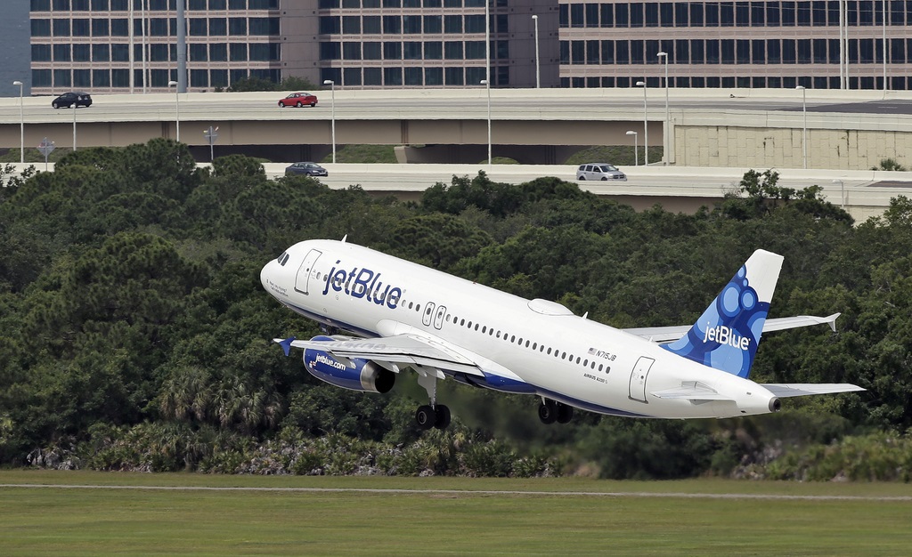 FILE - A JetBlue Airways Airbus A320-232 takes off from the Tampa International Airport in Tampa, Fla., May 15, 2014 (AP Photo/Chris O'Meara, File)
