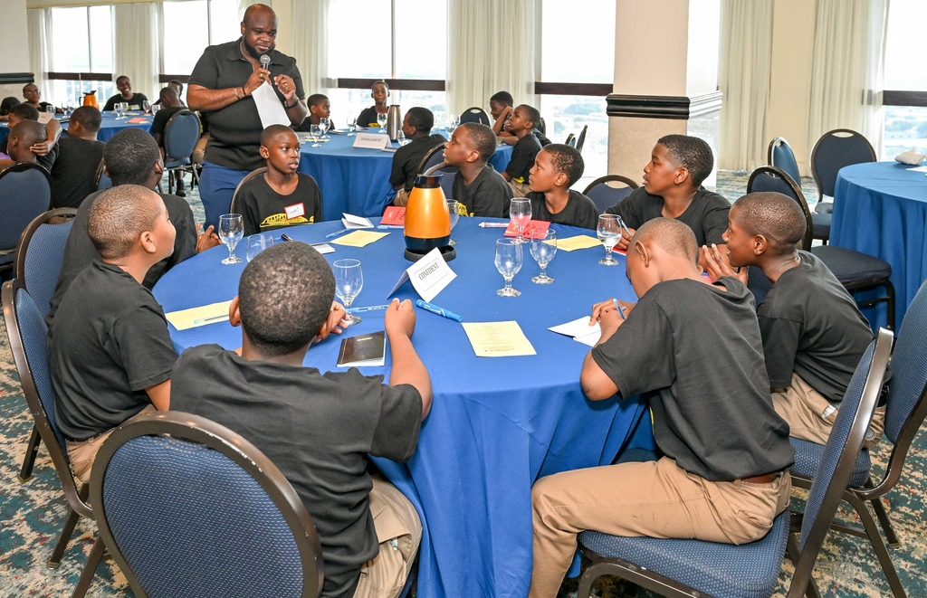 Verol A. Billet, Associate Clinical Psychologist interacting with students of Mico Practising Primary at the Women's Leadership Initiative's (WLI) "Conversations With Boys" workshop at the Jamaica Pegasus Hotel on January 15, 2025.